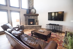 Huge fireplace, 65" tv and Bose sound bar, dish network and DVD