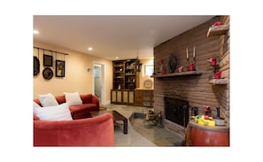 Fireplace and cool circular couch to enjoy it!