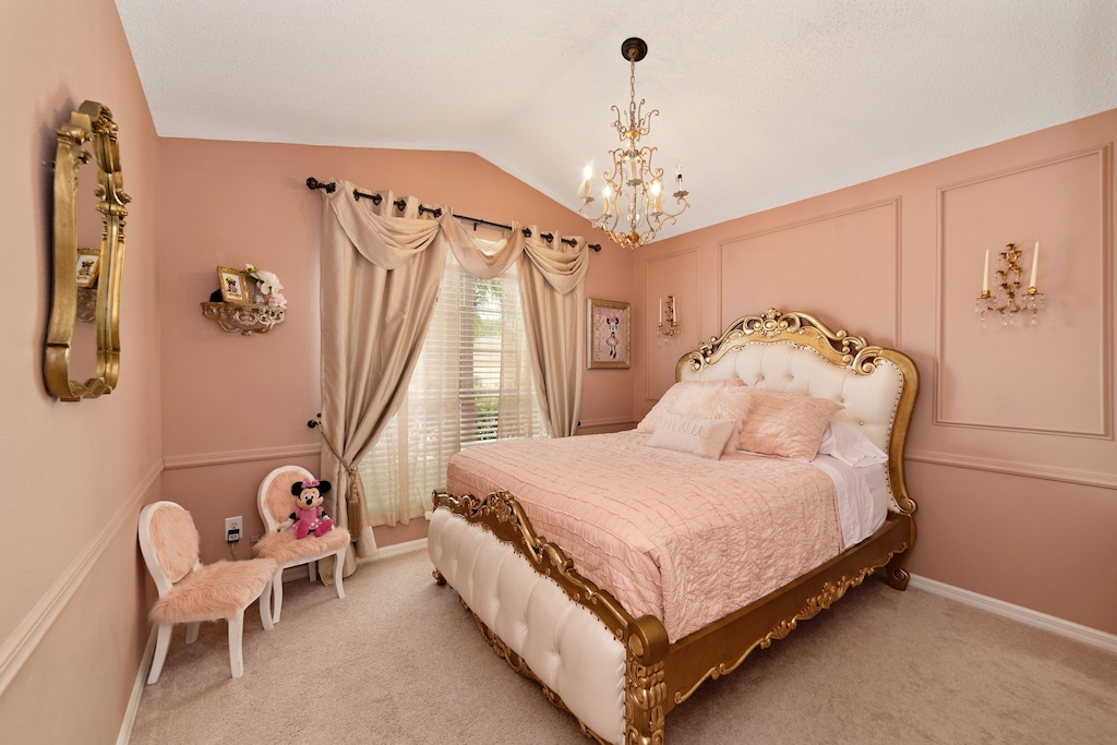 Minnie-Mouse Princess room queen bed. Toys and dress up in closet.