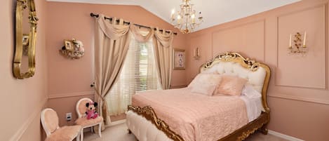 Minnie-Mouse Princess room queen bed. Toys and dress up in closet.