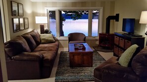 Living room has a large picture window overlooking the lake.