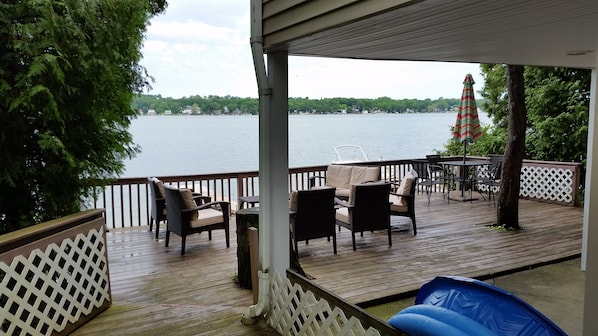 Deck has two outdoor sets that seat 8 plus an umbrella table with 4 additional