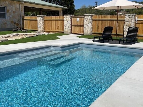 Newly remodeled yard with private pool, turf and putting green!