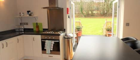 Kitchen looking out to garden and terraced area