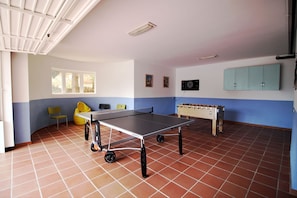 Leisure area with table tennis, table football and dart board
