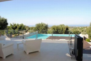 veranda with olive trees all around the villa