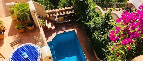 Rustic townhouse on 3 levels with pool, terraces and views over an orange grove.