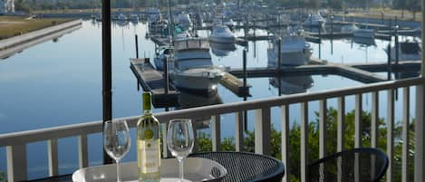 Seat on this bistro set of the Main bedroom with a marina view on the canal.