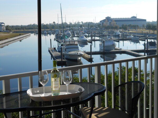 Seat on this bistro set of the Main bedroom with a marina view on the canal.