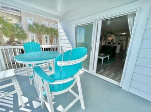 A spacious balcony with dining table and chairs. Oceanview, 102 Isle of Palms, SC | IOP Escapes