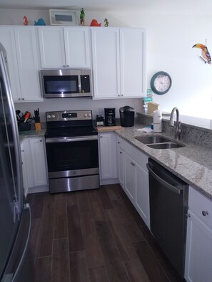 Kitchen - cabinets containing most anything you will need to cook + Keurig