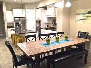 Spacious kitchen seats 14 between large table and counter