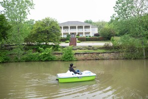 Paddle boat in private pond with view of the house.  Great for group photos