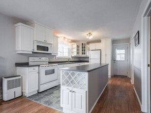 Open concept kitchen with breathtaking views that supplies all amenities needed