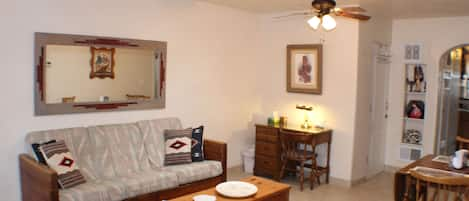 The living/dining area with Taos style couch and small desk perfect for working.