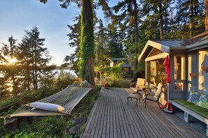 Hammock looks out over the spectacular water, sunset and mountain view