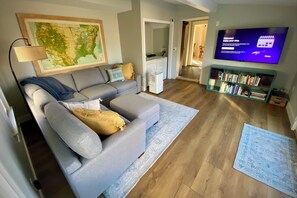 Living room with french doors to patio and steps to the kitchen.