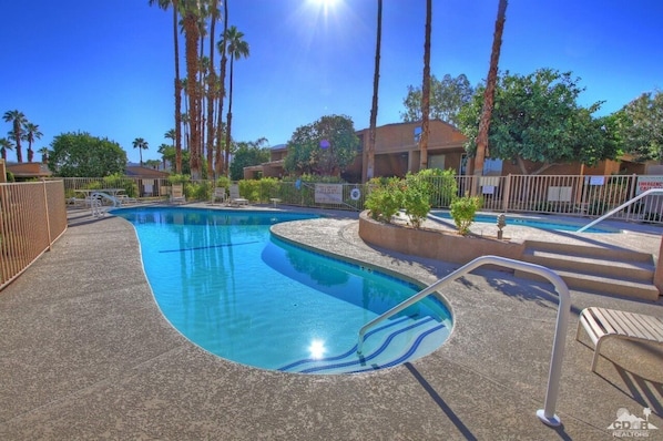 Our Covered Patio is behind the 3 palm trees, on the right side of this picture.