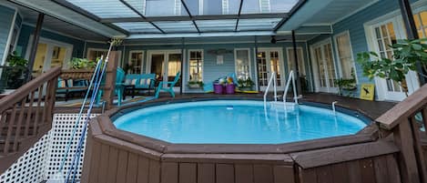 Heated pool in center of downstairs family living.