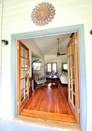 French doors allow the breeze blow through the living room. 