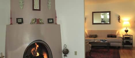 Welcome to Casa de Gallegos!  Enjoy the  kiva fireplace in dining area .