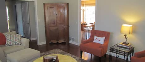 Living area with vaulted ceilings and comfy sofa and chairs