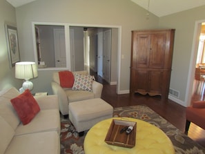 Partial view of living area and hallway to bedrooms