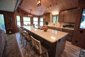 New kitchen appliances, countertop, and island.