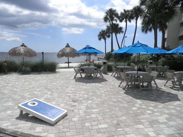 Waterfront seating at the Condo, bean toss, fishing, Volleyball.