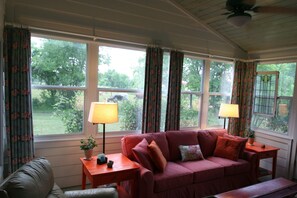 See the longhorns next door through the sunroom window!