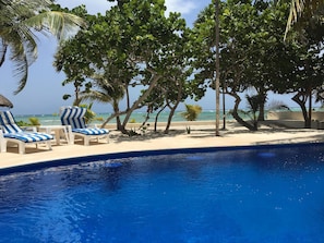 Private pool with loungers, looking out over Soliman Bay