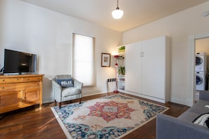 Another angle of the living room that shows the murphy bed while it's up. 