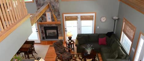 Beautiful stone fireplace and wall of windows main floor
