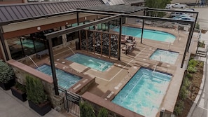 Four 20 person hot tubs with a view of the slopes