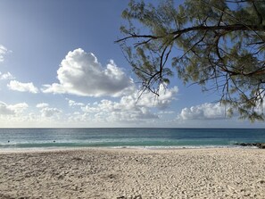 beach during the day in front of condo