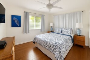 Spacious primary bedroom with comfortable Queen bed & natural light