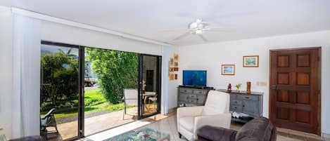 Living Room with Tropical Garden Views & Covered Furnished Patio