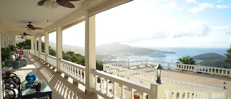 view of ocean and terrace for lounging and events from the south balcony