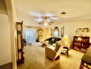 Livingroom stocked with books, games, and dvds