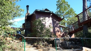 Eclectic 1927 cabin. Tree house Bridge span seen on right. Stairs go to parking.