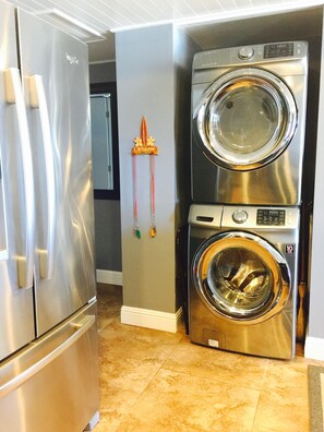 Brand new stainless steel washer and dryer.