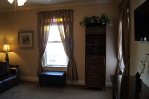 Oversize Victorian Windows Framed with Beautiful Drapes.