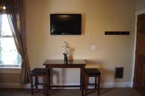 Dining Table and LED Smart TV with Streaming Capability.