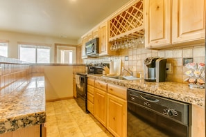 Fully equipped kitchen with granite countertops