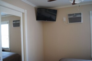 Bedroom 1 Features LED Smart TV, Ceiling Fan, AC and Mirrored Closet Door.