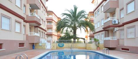 Swimming pool in front of the building 