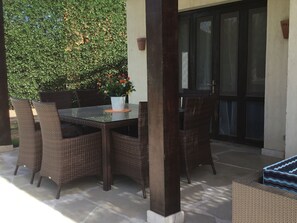 External dining area adjacent to pool