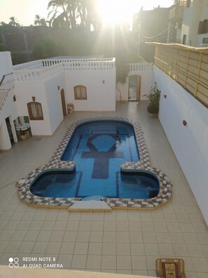 overview of Kharvilla pool walled courtyard, enjoy the sunset from balcony 