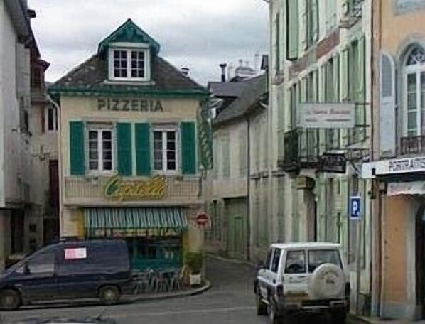 Our flat is thro the big green door on the right