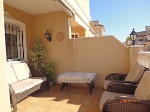 Front entrance with seating area and awning